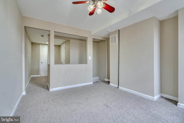 carpeted empty room with ceiling fan