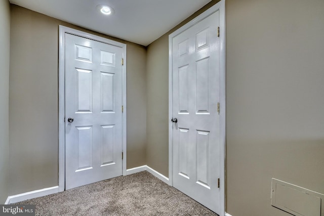 doorway with light colored carpet