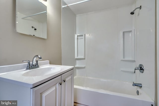 bathroom with vanity and  shower combination