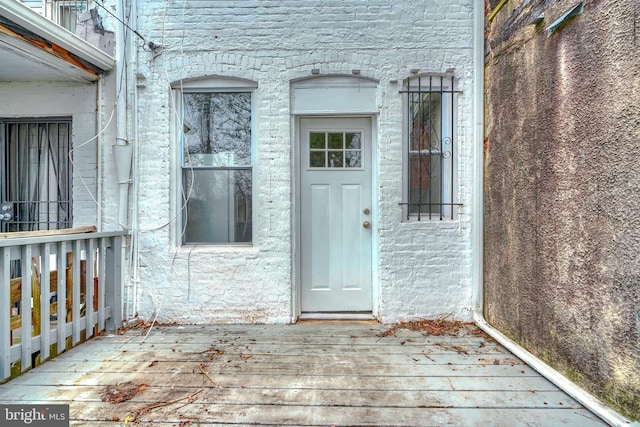 entrance to property featuring a deck