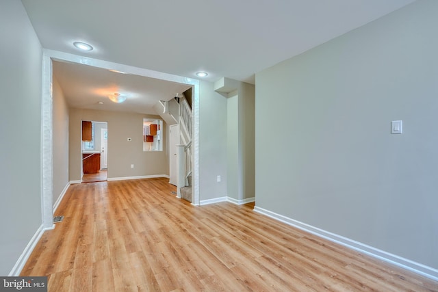 unfurnished living room featuring light wood-type flooring