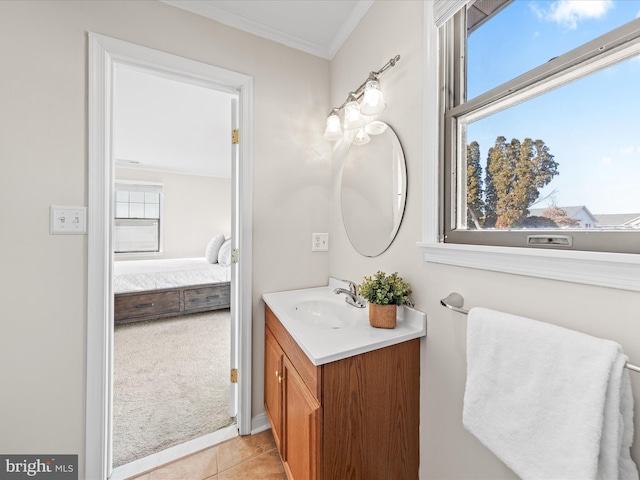 bathroom with crown molding, vanity, and tile patterned flooring