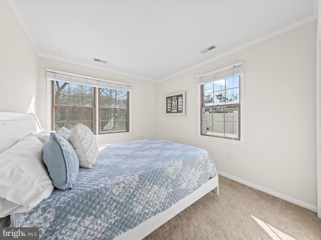 bedroom with crown molding and carpet floors