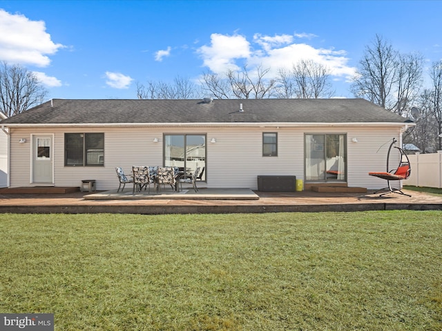 back of house featuring a yard