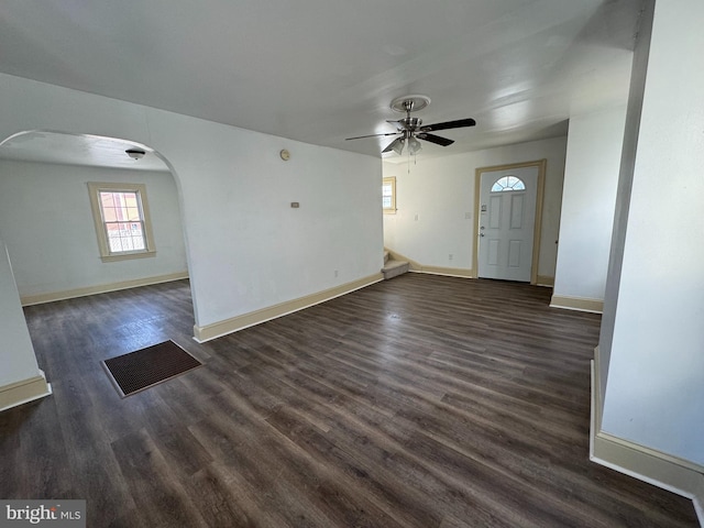 interior space featuring ceiling fan and dark hardwood / wood-style flooring