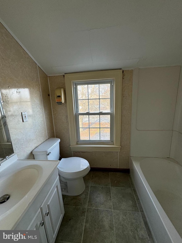 bathroom featuring vanity, lofted ceiling, and toilet