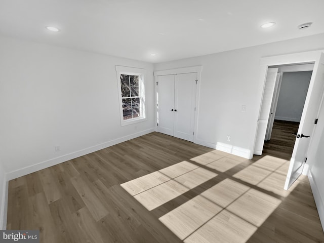 unfurnished bedroom featuring hardwood / wood-style floors