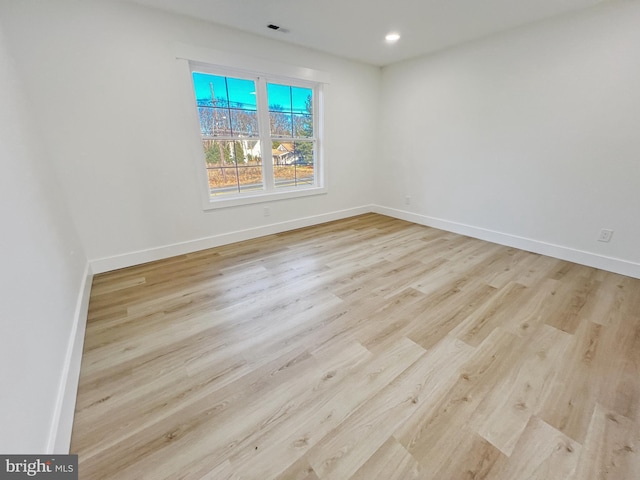 unfurnished room featuring light hardwood / wood-style flooring