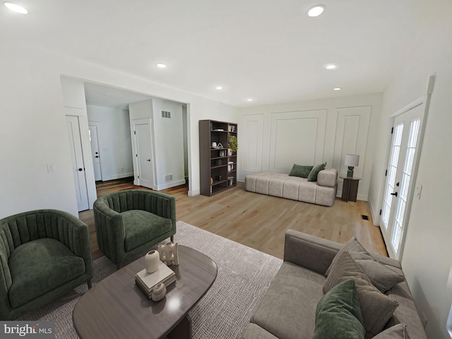 living room with light hardwood / wood-style flooring