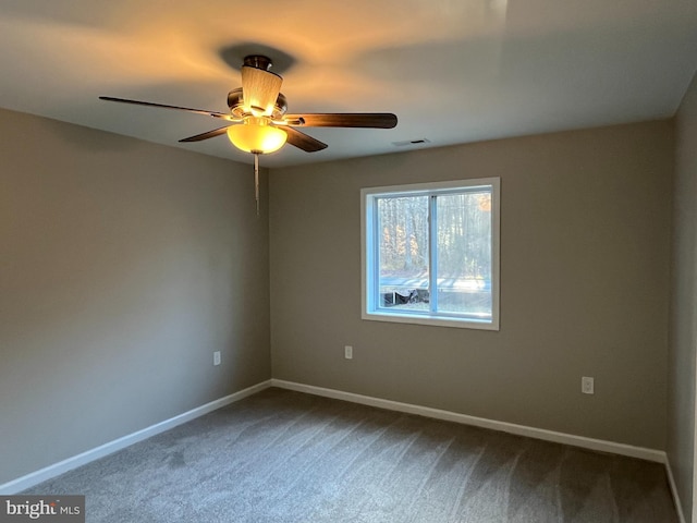 carpeted empty room featuring ceiling fan