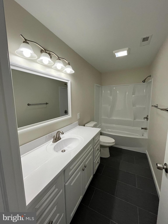 full bathroom featuring tile patterned flooring, bathing tub / shower combination, vanity, and toilet