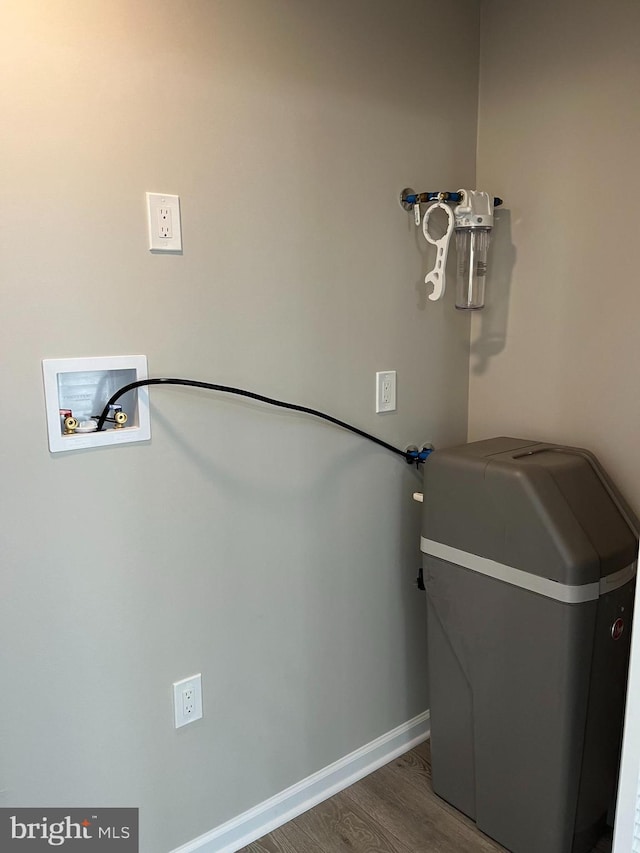 clothes washing area featuring hookup for a washing machine and hardwood / wood-style flooring