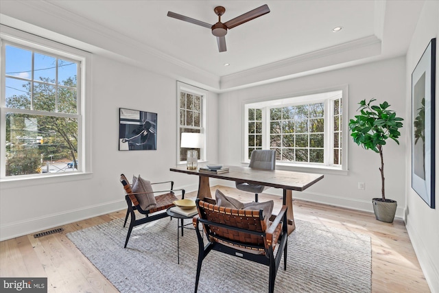 office area featuring plenty of natural light, crown molding, and visible vents