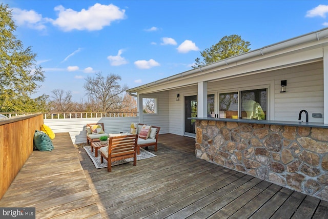 wooden deck featuring outdoor lounge area