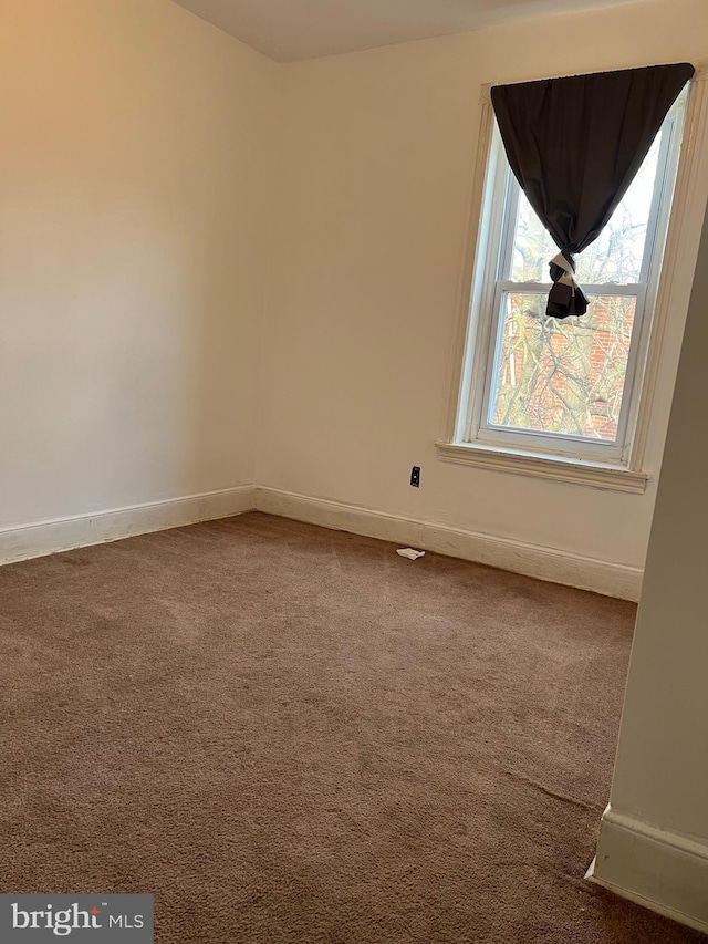 view of carpeted spare room