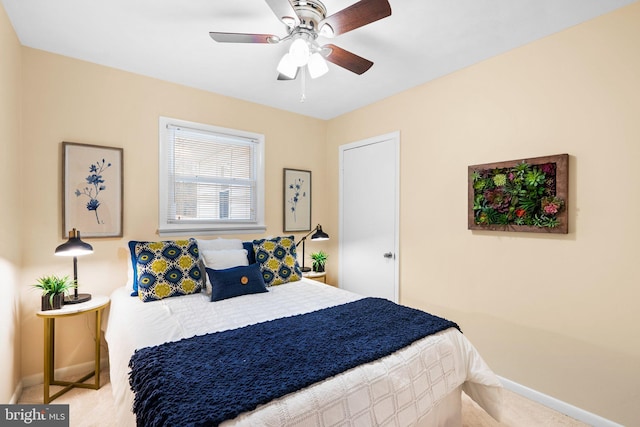 carpeted bedroom featuring ceiling fan