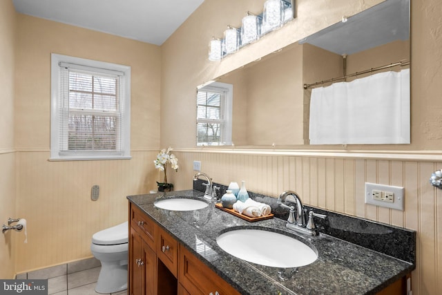 bathroom with vanity, toilet, and tile patterned flooring