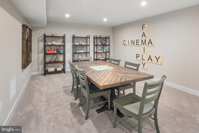 view of carpeted dining area