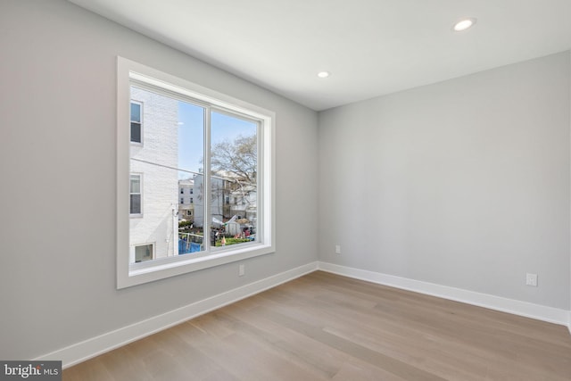 unfurnished room featuring light wood-type flooring