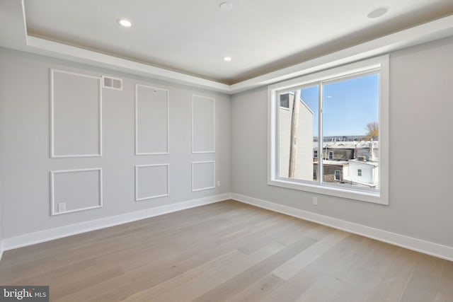 unfurnished room featuring light hardwood / wood-style floors