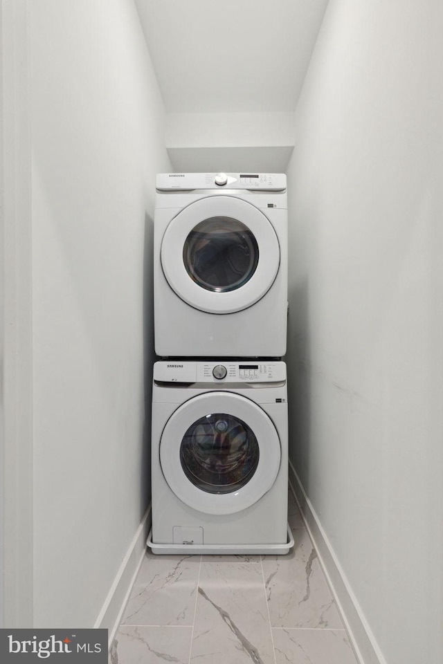 laundry room featuring stacked washer / dryer