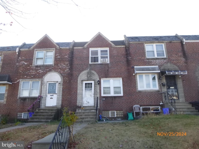 view of property featuring a front yard