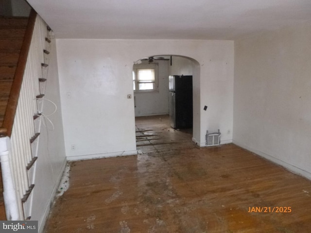 empty room with wood-type flooring