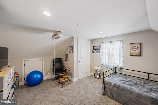 carpeted bedroom featuring vaulted ceiling