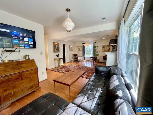 living room with light hardwood / wood-style flooring