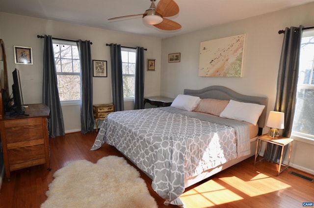 bedroom with wood-type flooring and ceiling fan