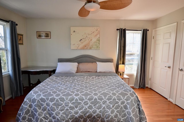 bedroom featuring hardwood / wood-style floors and ceiling fan