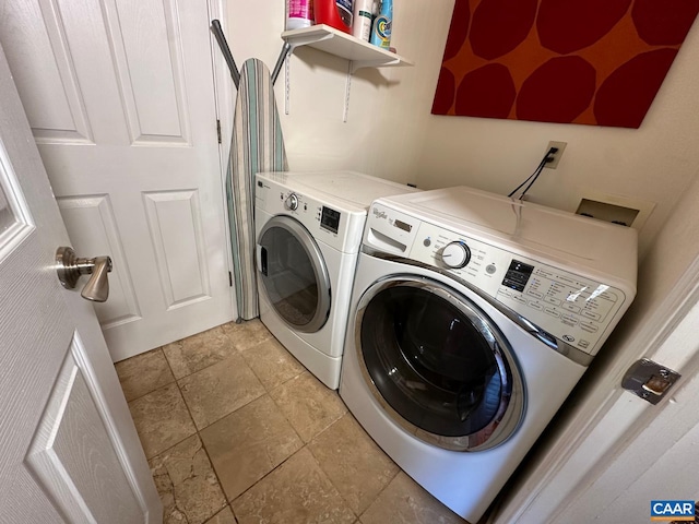 washroom featuring washing machine and dryer