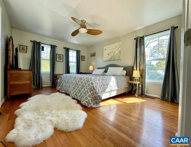 bedroom featuring hardwood / wood-style flooring and ceiling fan