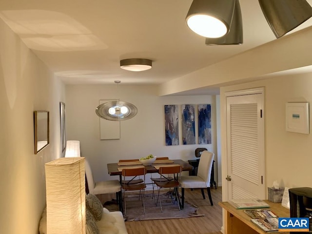 dining room with wood-type flooring