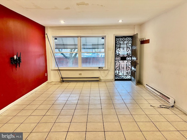 tiled entrance foyer featuring a baseboard radiator