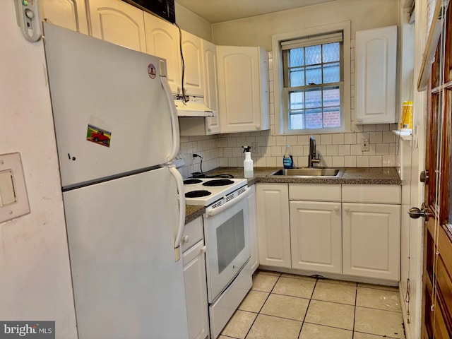 kitchen featuring tasteful backsplash, white cabinetry, sink, and white appliances