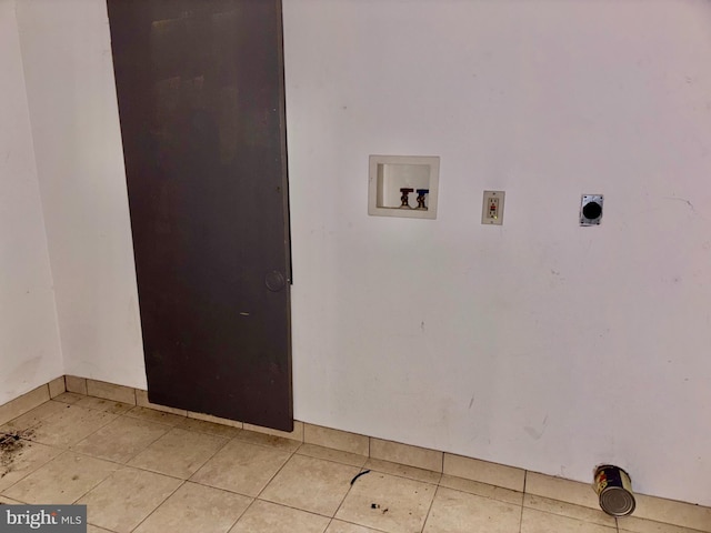 laundry room with washer hookup, hookup for an electric dryer, and light tile patterned floors