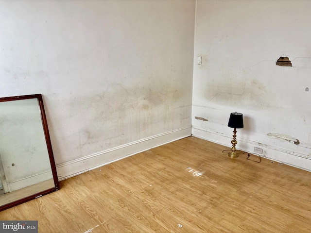 unfurnished room featuring light hardwood / wood-style flooring