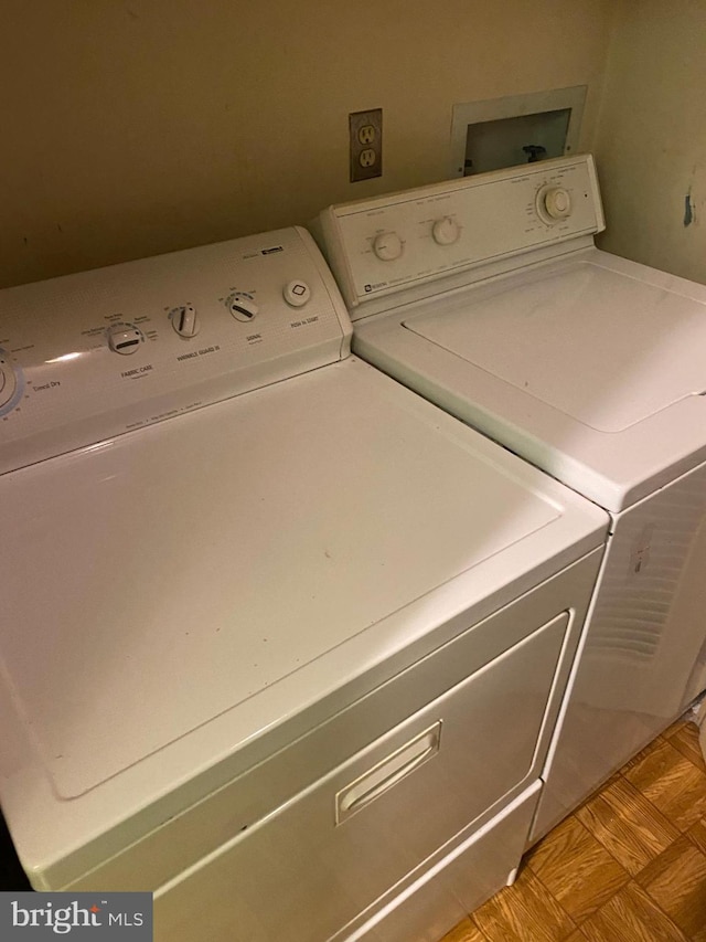 laundry room featuring separate washer and dryer