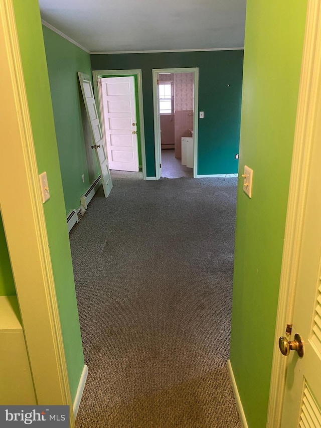 hallway featuring crown molding, a baseboard radiator, and carpet