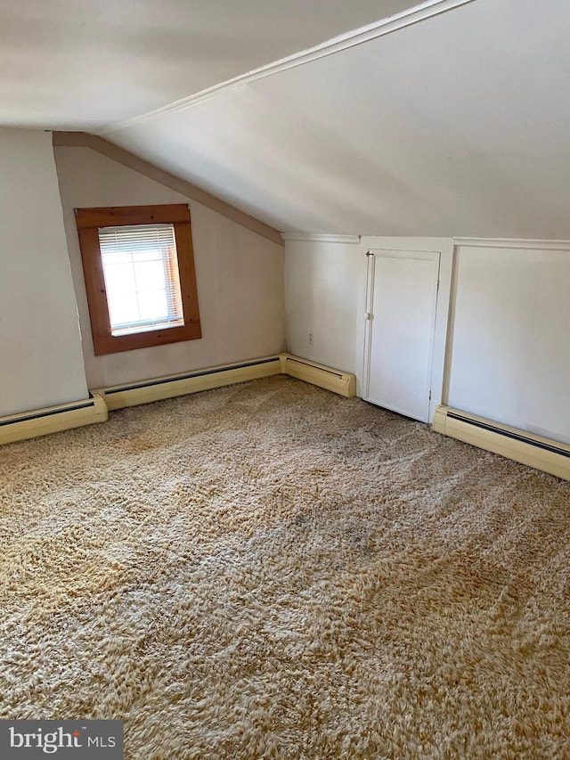 bonus room with lofted ceiling, carpet floors, and a baseboard heating unit