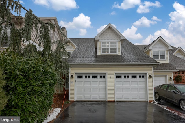 view of front of property with a garage