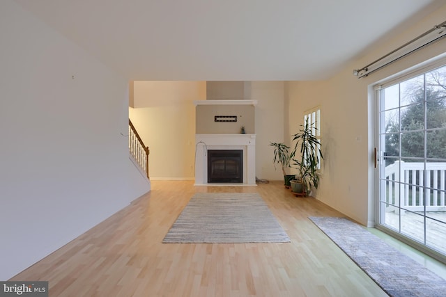 unfurnished living room with light hardwood / wood-style floors