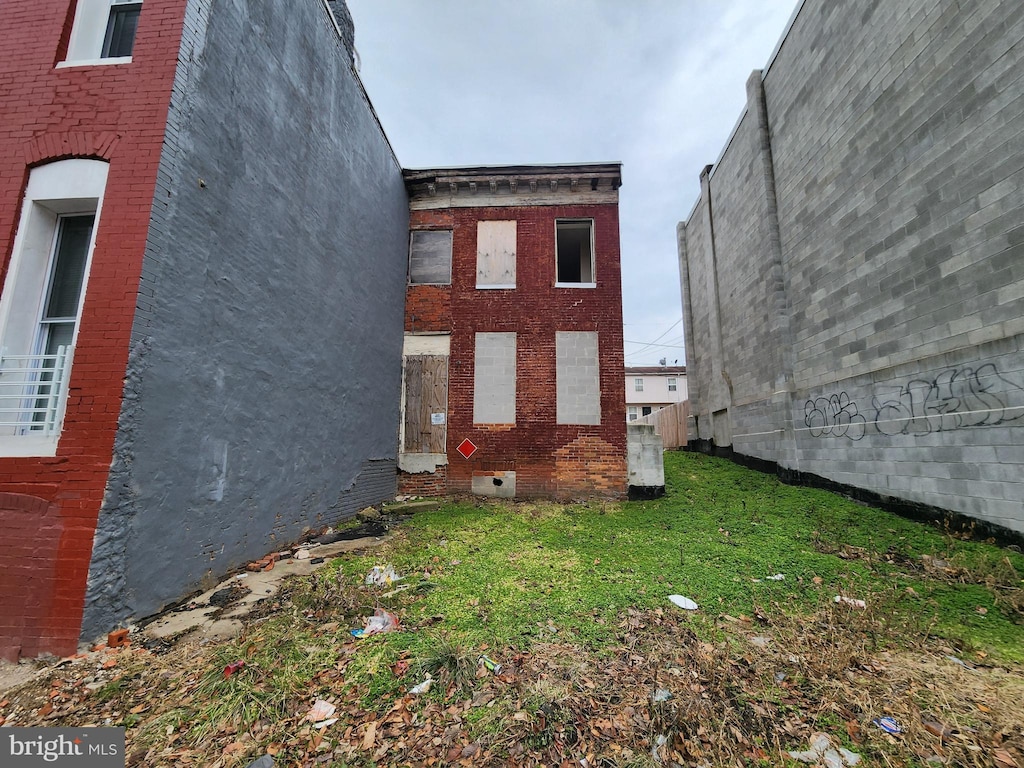 view of side of property with a yard