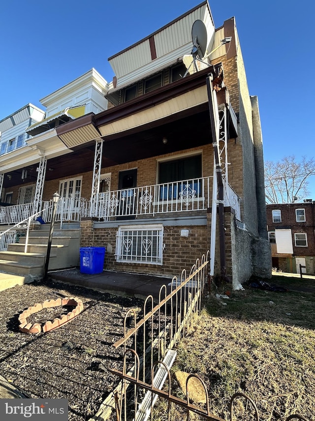 view of side of home with a porch