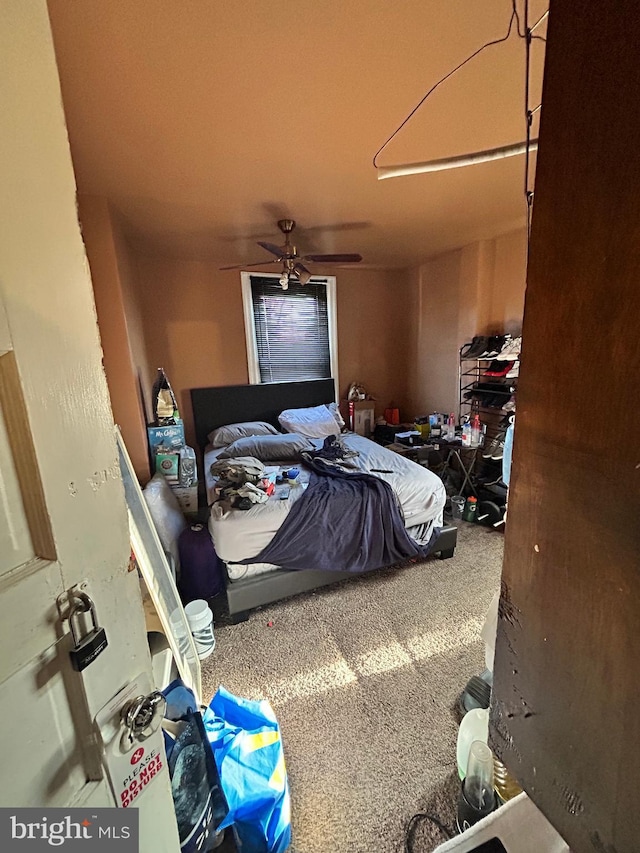 carpeted bedroom with ceiling fan