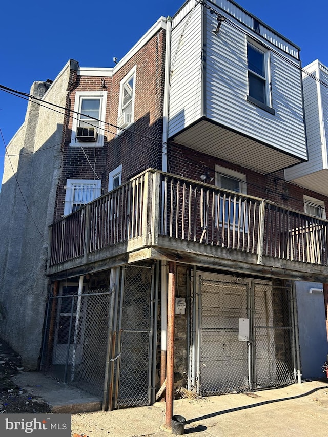 back of house featuring a balcony