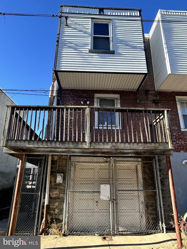 back of house with a balcony