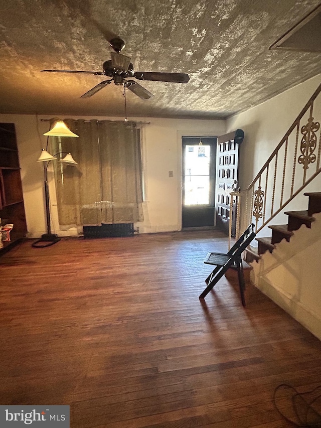 entrance foyer featuring ceiling fan and dark hardwood / wood-style floors