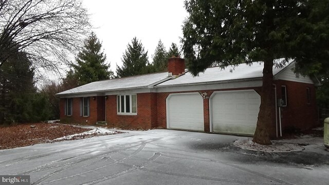 ranch-style home with a garage